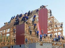people building structure during daytime