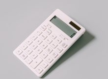 white calculator on white table